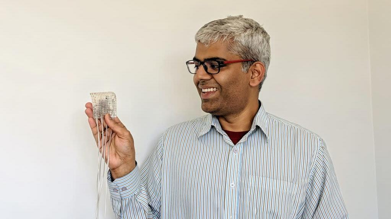 Lead author Gopala Anumanchipalli holding an intracranial electrode of the type used to record brain activity in the new study.